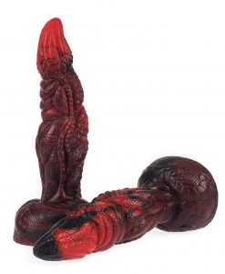 Close-up of the Drodong Dragon Dildo tip showing the bright red point and black accents