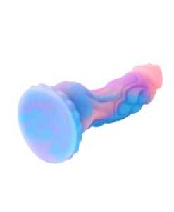 Close-up of the Fairy Dragon Dildo tip showing pink silicone with embedded sparkle finish
