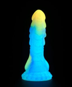 Close-up of the Fairy Dragon Dildo base showing scalloped edges and blue-purple silicone