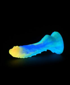 The Fairy Dragon Dildo photographed from a low angle showing full height and colour blend