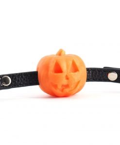 Side view of the Pumpkin Ball Gag showing the orange pumpkin sphere and adjustable black strap