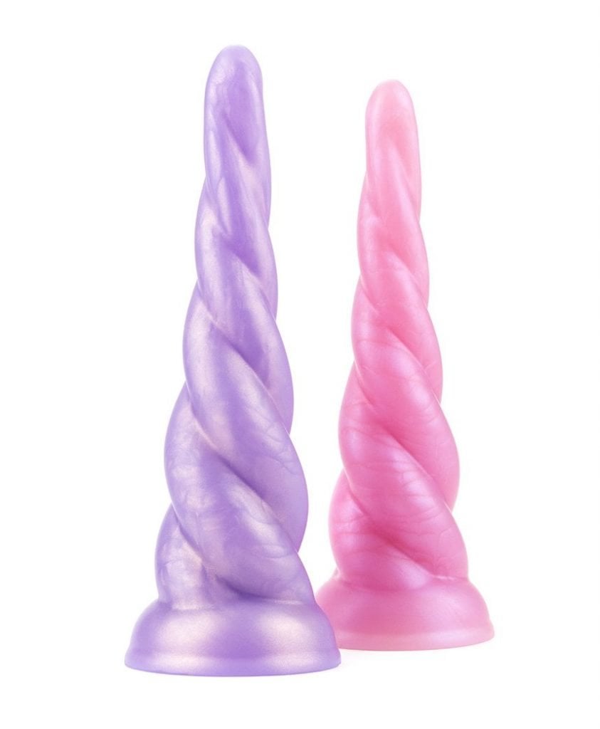 Pastel lavender and pink Unicorn Dildo pair with spiralling horn design and suction cup bases