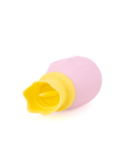 Side view of the Princess Peachy Stimulator showing the ribbed texture and pastel pink body