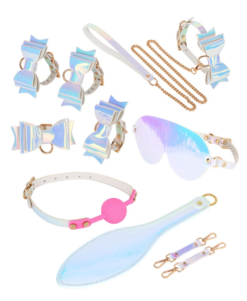 Complete Moonlight Kawaii Bondage Kit flat lay with holographic cuffs, collar, paddle and gag