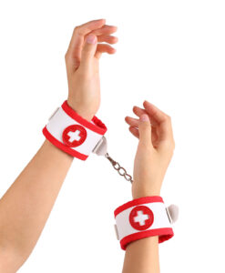White and red nurse-themed wrist cuffs with fur lining, metal chain and red cross emblems