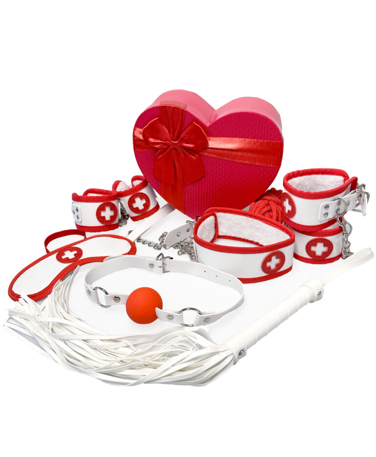 Complete Nurse Bondage Kit flat lay with white and red cuffs, gag, flogger, collar, rope and gift box
