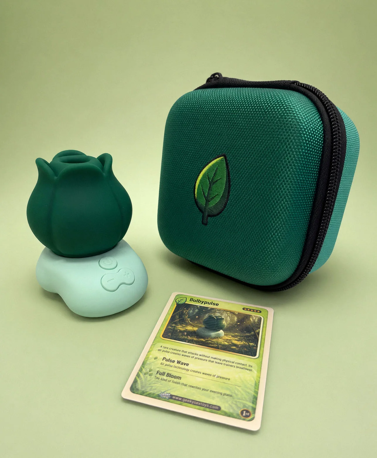 Bulbypulse suction toy beside its green storage case and First Edition collector card