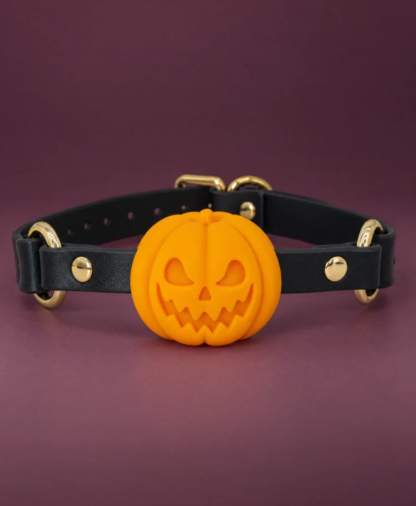 Front close-up of the Pumpkin Gag on a smooth smoky plum studio background